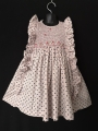 Robe smocks sans manches à volants en coton rose pâle imprimé