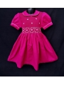 Robe smocks manches ballons col Claudine en coton piqué fuchsia