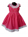 Robe smocks sans manches en coton rose bordure fleurie